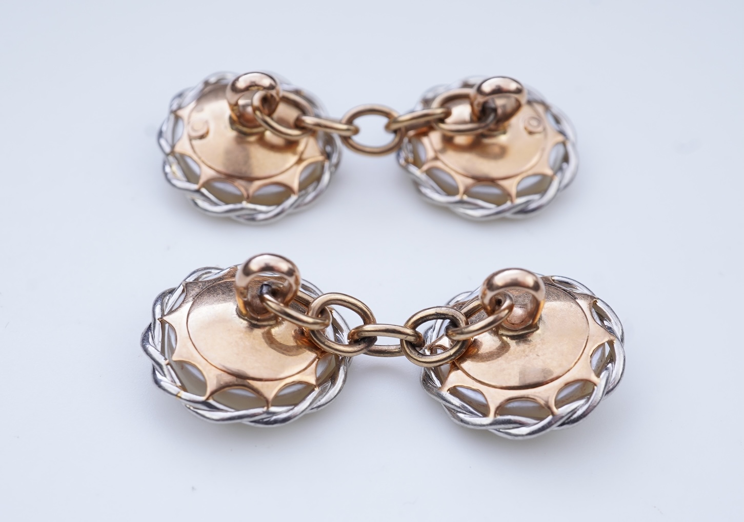 A pair of mother of pearl cufflinks, early 20th century